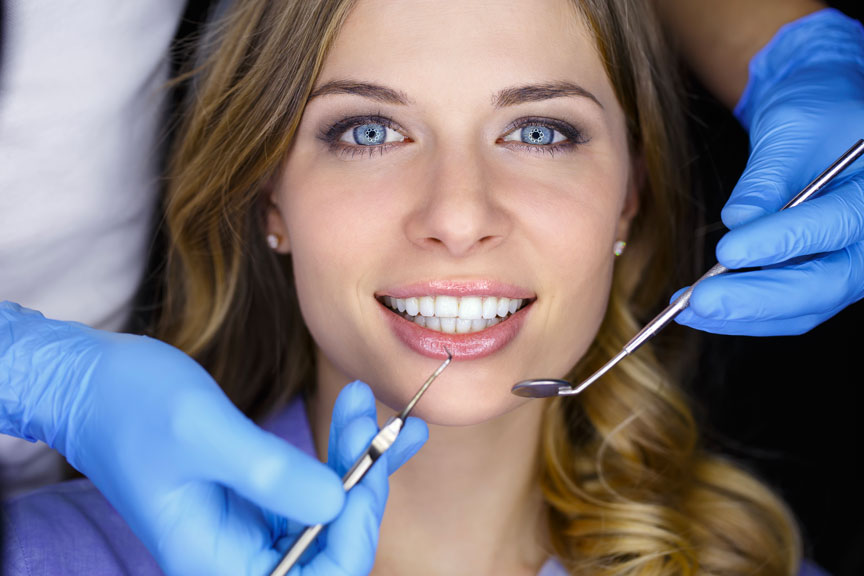 Woman Getting Smile Makeover From Dentist